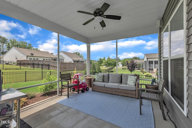 2626 Nassau Trce, Fuquay Varina, NC 27526 - sunroom with outdoor lounge area, a ceiling fan, and a residential view