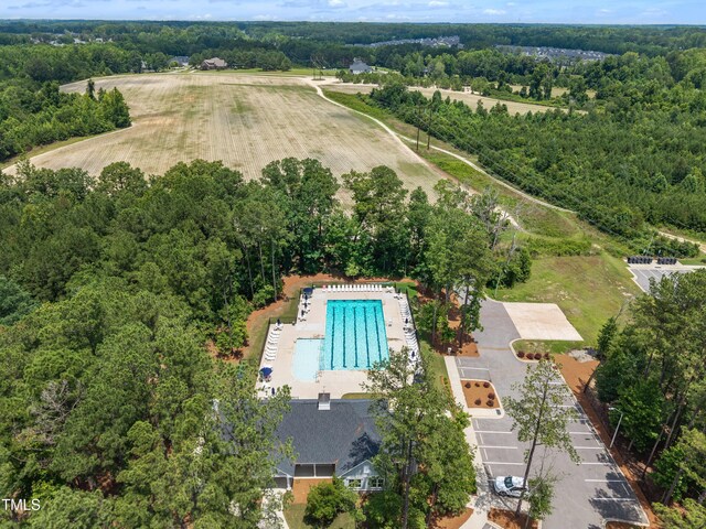 2626 Nassau Trce, Fuquay Varina, NC 27526 - drone / aerial view of a pool area and a forest