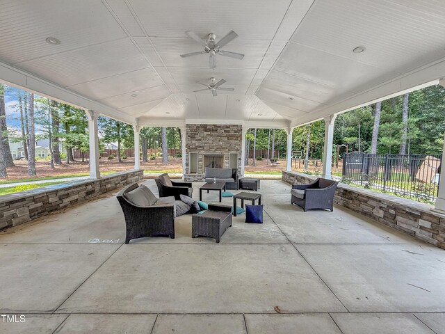 2626 Nassau Trce, Fuquay Varina, NC 27526 - view of patio / terrace with an outdoor living space with a fireplace and a ceiling fan