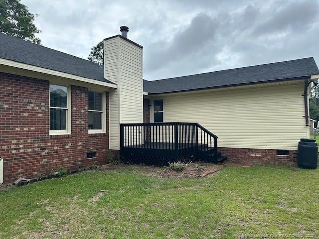 162 E Twelve Oaks Rd, Raeford, NC 28376 - rear view of property featuring crawl space, a yard, a deck, and a chimney