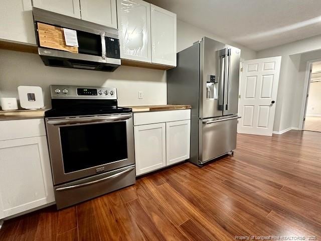 162 E Twelve Oaks Rd, Raeford, NC 28376 - kitchen featuring stainless steel appliances, dark wood finished floors, white cabinetry, and light countertops