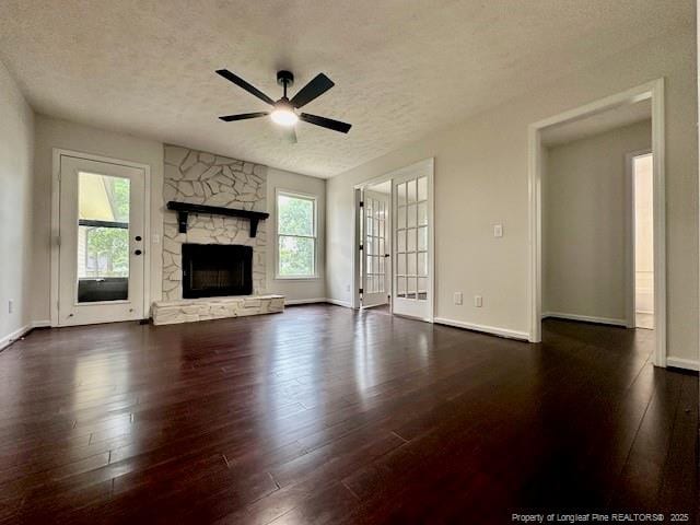 162 E Twelve Oaks Rd, Raeford, NC 28376 - unfurnished living room with a ceiling fan, a textured ceiling, healthy amount of natural light, and wood-type flooring