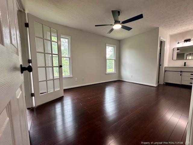 162 E Twelve Oaks Rd, Raeford, NC 28376 - spare room with dark wood-style floors and a ceiling fan