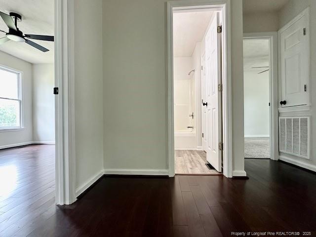 162 E Twelve Oaks Rd, Raeford, NC 28376 - hallway featuring dark wood-style floors and baseboards
