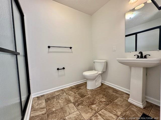 162 E Twelve Oaks Rd, Raeford, NC 28376 - bathroom with baseboards and a stall shower
