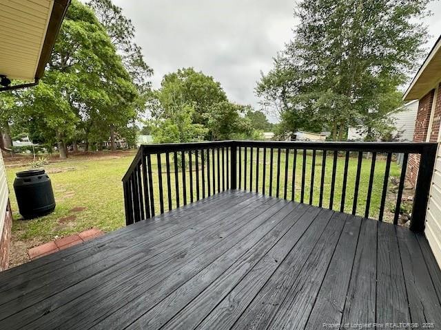 162 E Twelve Oaks Rd, Raeford, NC 28376 - wooden terrace featuring a lawn