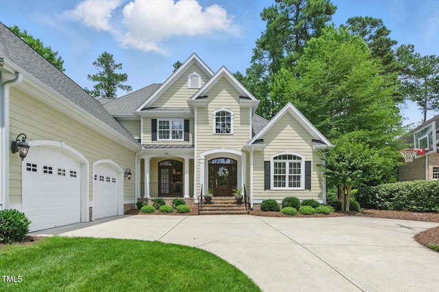 812 Bear Tree Crk, Chapel Hill, NC 27517 - view of front of house featuring concrete driveway, covered porch, a garage, and roof with shingles