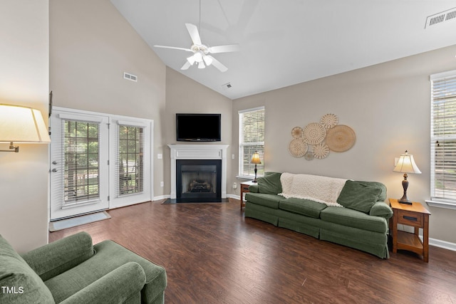 100 Tobacco Leaf Ln, Apex, NC 27502 - living area with a ceiling fan, a fireplace with flush hearth, wood finished floors, and high vaulted ceiling