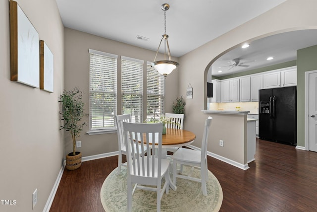 100 Tobacco Leaf Ln, Apex, NC 27502 - dining room featuring arched walkways, a ceiling fan, dark wood-type flooring, and recessed lighting