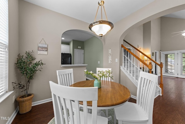 100 Tobacco Leaf Ln, Apex, NC 27502 - dining area featuring dark wood finished floors, a ceiling fan, and arched walkways