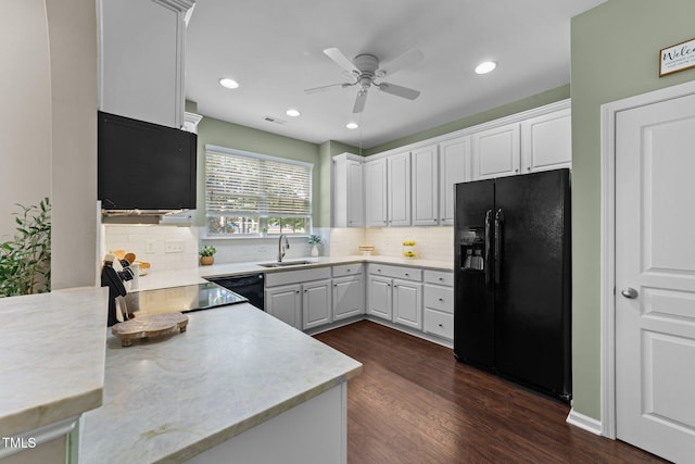 100 Tobacco Leaf Ln, Apex, NC 27502 - kitchen featuring black appliances, a ceiling fan, backsplash, dark wood-style flooring, and white cabinets