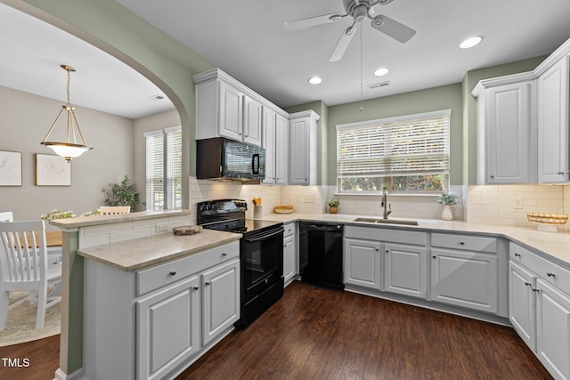 100 Tobacco Leaf Ln, Apex, NC 27502 - kitchen featuring black appliances, a peninsula, ceiling fan, plenty of natural light, and recessed lighting