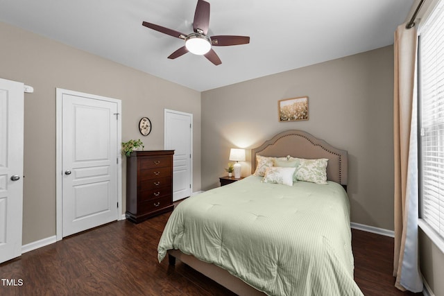 100 Tobacco Leaf Ln, Apex, NC 27502 - bedroom with dark wood-style flooring and ceiling fan