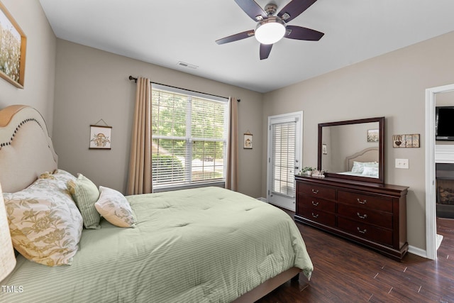 100 Tobacco Leaf Ln, Apex, NC 27502 - bedroom with dark wood finished floors and a ceiling fan