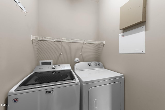 100 Tobacco Leaf Ln, Apex, NC 27502 - laundry area featuring washing machine and clothes dryer