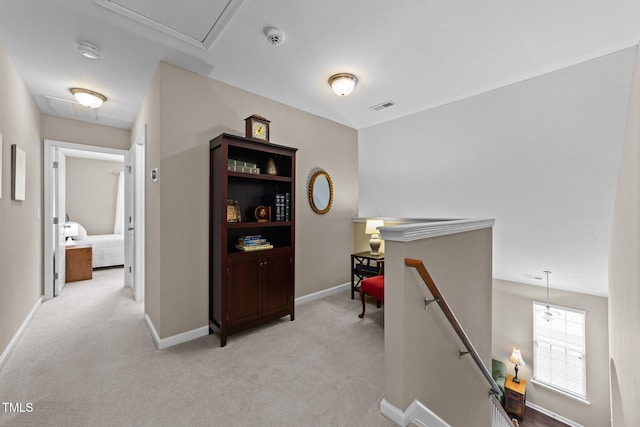 100 Tobacco Leaf Ln, Apex, NC 27502 - hall featuring an upstairs landing, light carpet, and attic access