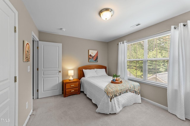100 Tobacco Leaf Ln, Apex, NC 27502 - bedroom with light colored carpet and baseboards