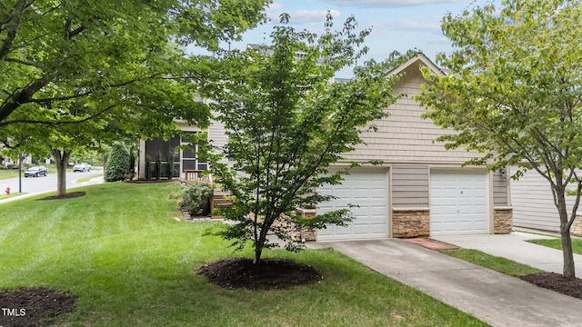100 Tobacco Leaf Ln, Apex, NC 27502 - view of grassy yard featuring a garage and driveway