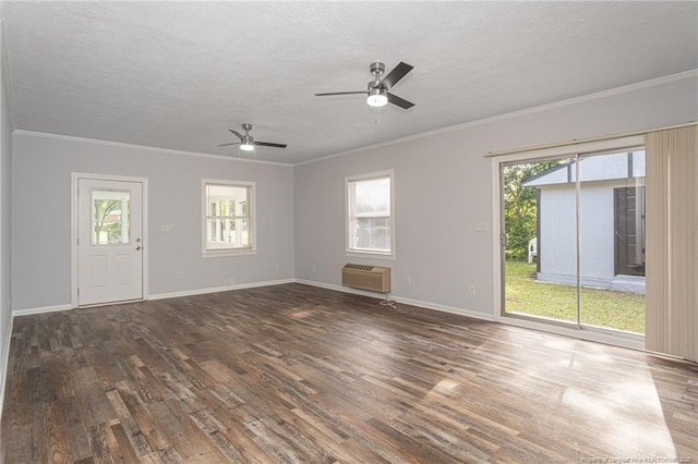 2110 Lombardy Dr, Fayetteville, NC 28304 - unfurnished living room featuring wood finished floors, ornamental molding, ceiling fan, a textured ceiling, and a wall mounted AC
