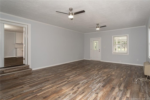 2110 Lombardy Dr, Fayetteville, NC 28304 - unfurnished living room featuring dark wood-style flooring, a ceiling fan, a textured ceiling, and crown molding