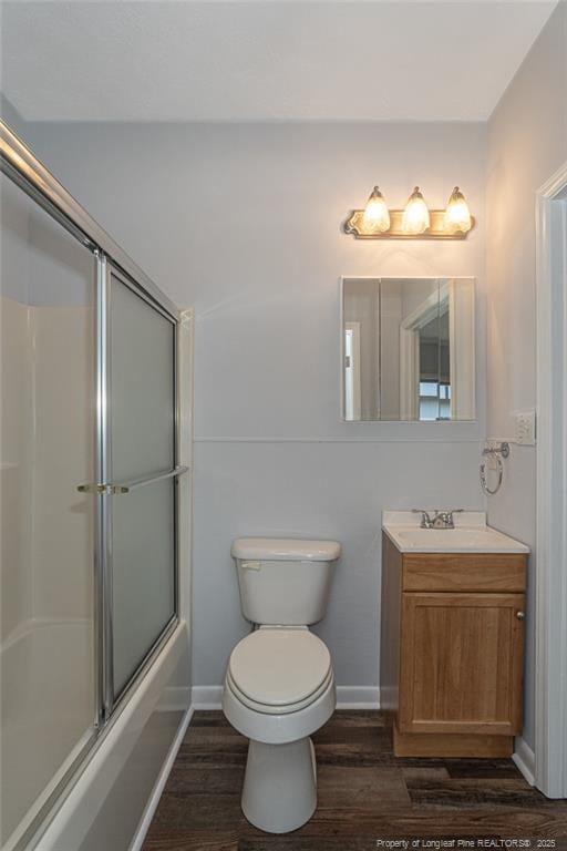 2110 Lombardy Dr, Fayetteville, NC 28304 - full bathroom with wood finished floors, vanity, and bath / shower combo with glass door