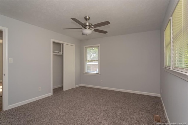 2110 Lombardy Dr, Fayetteville, NC 28304 - unfurnished bedroom featuring carpet, a closet, and a ceiling fan