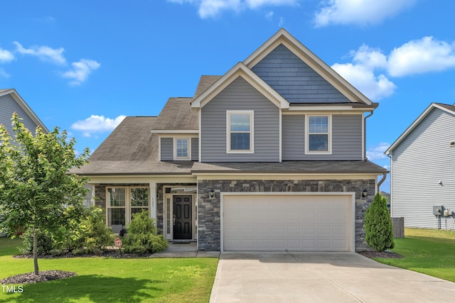525 Willow Breeze Ct, Zebulon, NC 27597 - craftsman-style house featuring concrete driveway, a front lawn, a garage, and stone siding