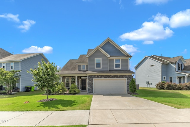 525 Willow Breeze Ct, Zebulon, NC 27597 - craftsman house featuring driveway, an attached garage, a front yard, and stone siding