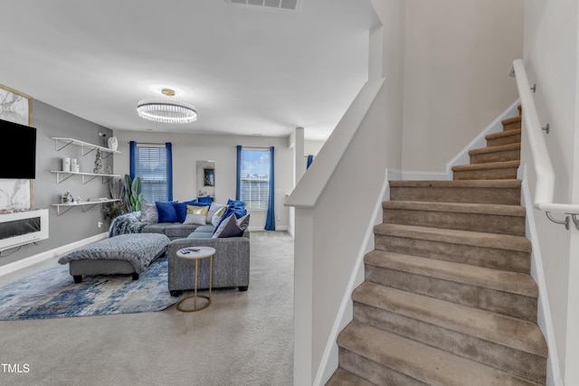 525 Willow Breeze Ct, Zebulon, NC 27597 - living room featuring stairway and carpet flooring