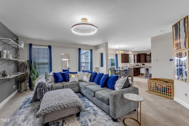 525 Willow Breeze Ct, Zebulon, NC 27597 - living area with a chandelier, healthy amount of natural light, and light carpet
