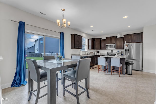 525 Willow Breeze Ct, Zebulon, NC 27597 - dining room featuring a chandelier and recessed lighting