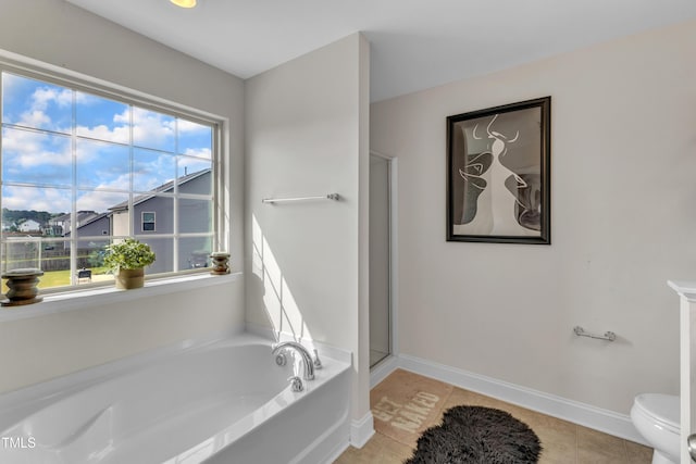 525 Willow Breeze Ct, Zebulon, NC 27597 - bathroom with a bath, tile patterned flooring, and a shower with shower door