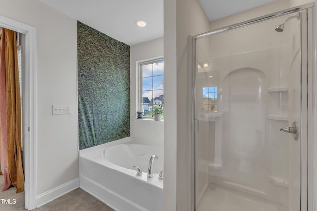 525 Willow Breeze Ct, Zebulon, NC 27597 - full bathroom with a shower stall, a bath, tile patterned flooring, and an accent wall