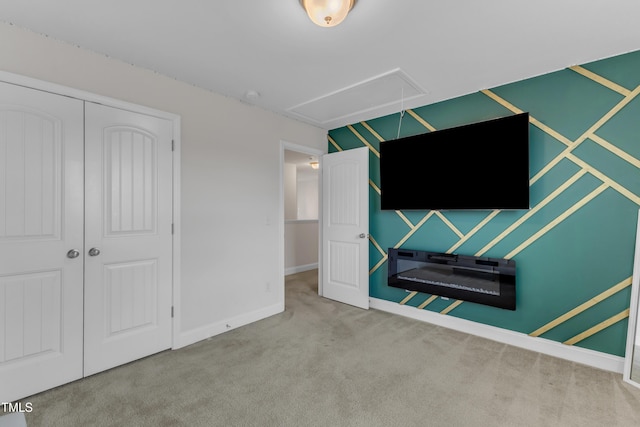 525 Willow Breeze Ct, Zebulon, NC 27597 - unfurnished bedroom with attic access, carpet, and a closet