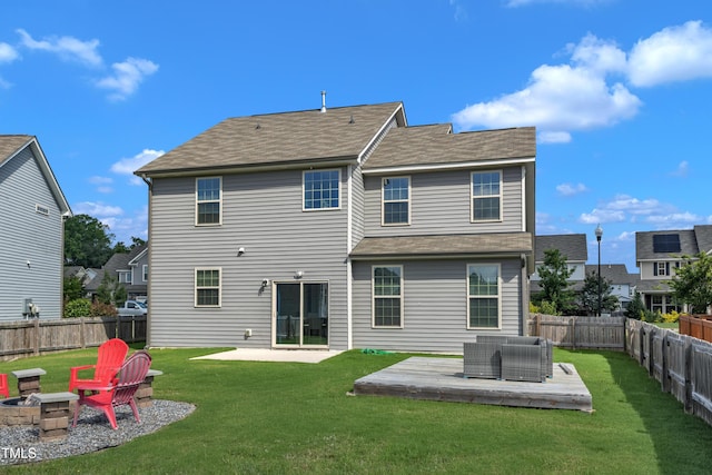 525 Willow Breeze Ct, Zebulon, NC 27597 - rear view of property with a fenced backyard, a fire pit, a wooden deck, and a patio area