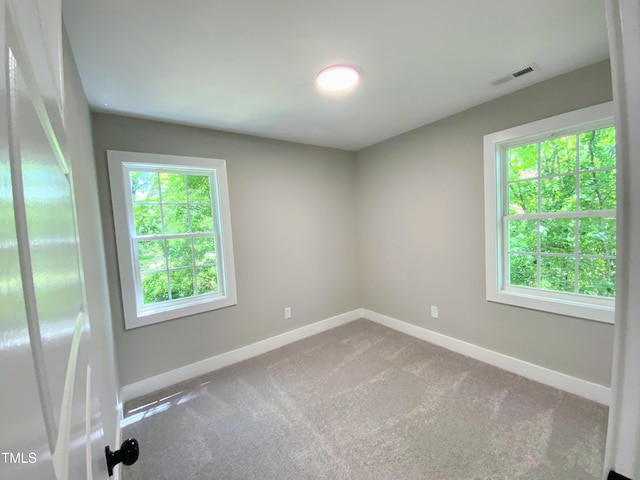608 E Umstead St, Durham, NC 27701 - spare room featuring baseboards and carpet flooring