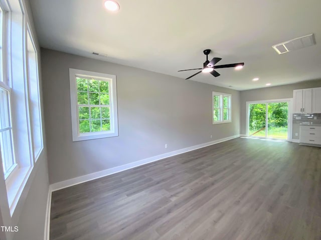 608 E Umstead St, Durham, NC 27701 - unfurnished living room with wood finished floors, a ceiling fan, and recessed lighting