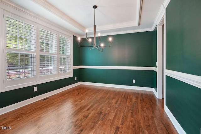 1962 Briar Chapel Pkwy, Chapel Hill, NC 27516 - empty room featuring a chandelier, healthy amount of natural light, wood finished floors, ornamental molding, and a tray ceiling