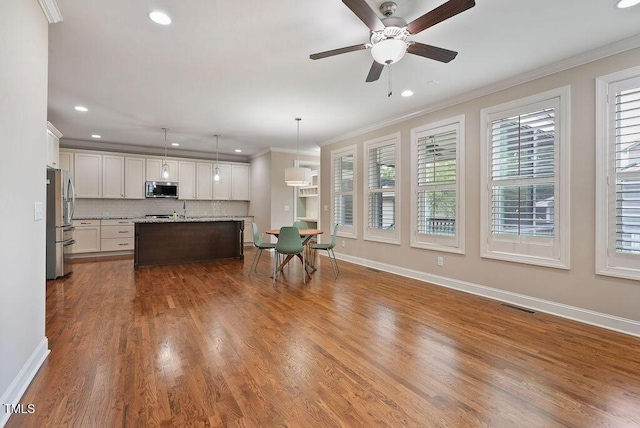 1962 Briar Chapel Pkwy, Chapel Hill, NC 27516 - living area with recessed lighting, ceiling fan, ornamental molding, and dark wood-style flooring