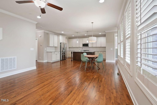 1962 Briar Chapel Pkwy, Chapel Hill, NC 27516 - dining room with crown molding, recessed lighting, ceiling fan, and dark wood-type flooring