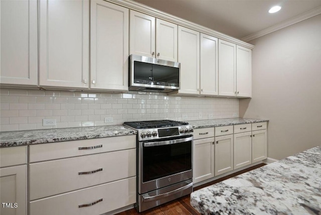 1962 Briar Chapel Pkwy, Chapel Hill, NC 27516 - kitchen with stainless steel appliances, ornamental molding, decorative backsplash, dark wood-style flooring, and light stone countertops