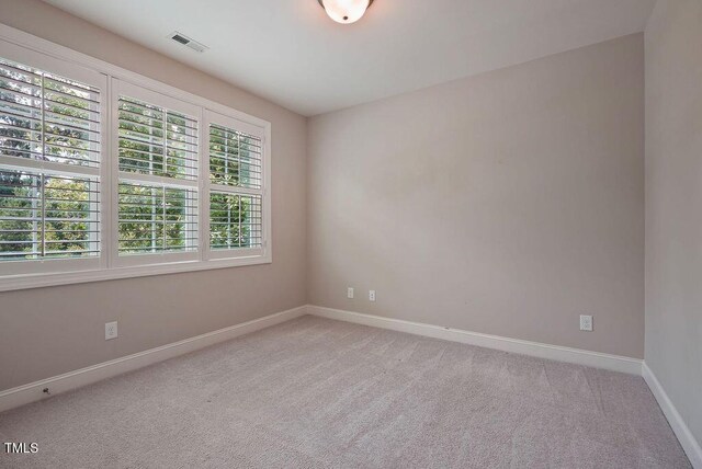 1962 Briar Chapel Pkwy, Chapel Hill, NC 27516 - empty room featuring healthy amount of natural light and light carpet