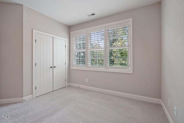 1962 Briar Chapel Pkwy, Chapel Hill, NC 27516 - unfurnished bedroom featuring carpet floors and a closet