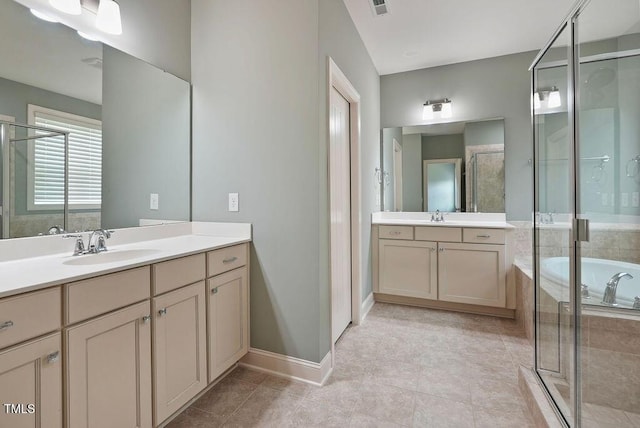 1962 Briar Chapel Pkwy, Chapel Hill, NC 27516 - bathroom with a stall shower, two vanities, tile patterned floors, and a garden tub