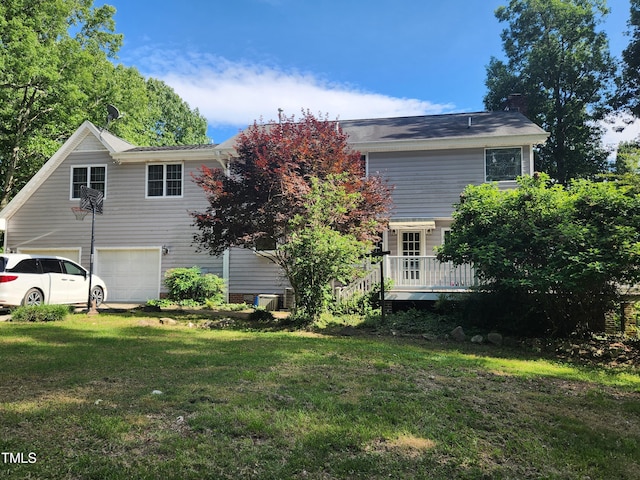 5760 Hesters Store Rd, Hurdle Mills, NC 27541 - rear view of property with an attached garage, a yard, a wooden deck, and a chimney
