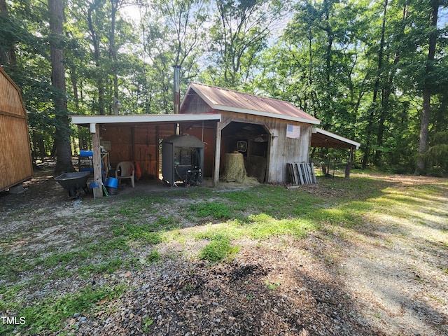 5760 Hesters Store Rd, Hurdle Mills, NC 27541 - view of pole building with a carport