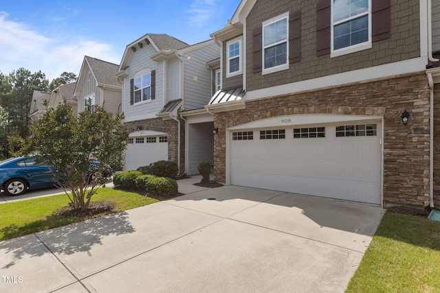 9302 Nellman Ln, Raleigh, NC 27617 - multi unit property with stone siding, an attached garage, and driveway
