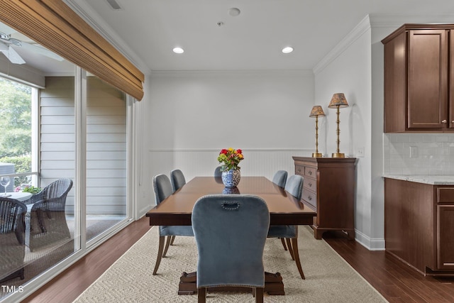 9302 Nellman Ln, Raleigh, NC 27617 - dining area with crown molding, dark wood-type flooring, a wainscoted wall, and recessed lighting