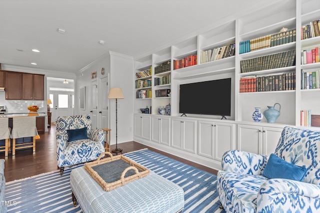 9302 Nellman Ln, Raleigh, NC 27617 - living room featuring dark wood-type flooring, crown molding, built in features, and recessed lighting