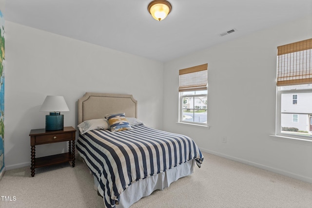 9302 Nellman Ln, Raleigh, NC 27617 - bedroom featuring multiple windows and carpet